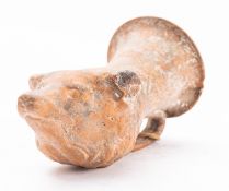 A Helenistic pottery rhyton modelled as the head of a fox, later 4th century B.C.