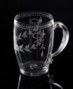 A late Georgian soda glass tankard of barrel form with flattened loop handle,