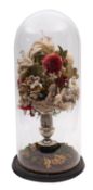 A Victorian woolwork floral display with glass dome,
