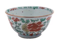 A Chinese wucai bowl, Transitional painted with scrolling stems of peony and chrysanthemum,