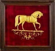 A gilt metal relief of a horse,