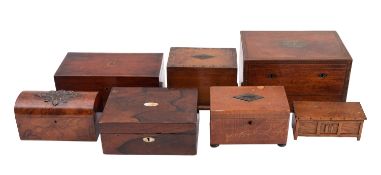 A group of seven various wooden boxes,
