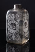 A Dutch glass liqueur flask of shouldered square profile each facet engraved with a panel