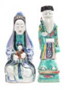 A Chinese polychrome figure of Guanyin and a figure of an Immortal,