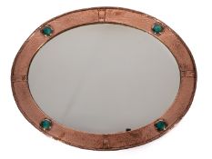 An Arts & Crafts copper and 'Ruskin enamel' set oval wall mirror,