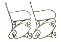 A pair of wrought iron garden bench ends,