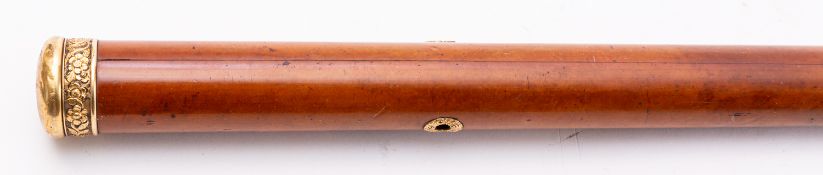 An early Victorian malacca and 18ct gold mounted walking cane,