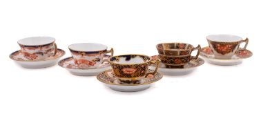Five Royal Crown Derby miniature porcelain cups and saucers each decorated in various Imari
