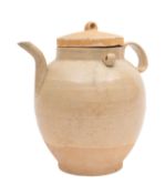 A Chinese Yue Ware ewer and cover of oviform with short spout and ribbed strap handle the shoulders