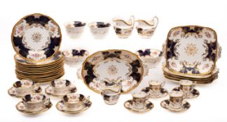 A Coalport porcelain 'bat wing' tea service, comprising twenty two cups, fifteen saucers,