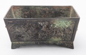A Chinese bronze censer of rectangular form on four pointed feet,