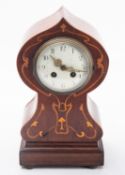 Art Nouveau tulip-shaped French mantel clock having an eight-day duration movement striking the