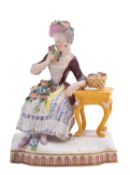 A Meissen model of a lady emblematic of the sense of smell,