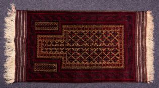 A Balouchistan prayer rug, the camel geometric mihrab with all over serrated leaf lozenge designs,