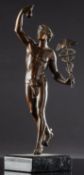 A small bronzed metal figure of Mercury, after Giambologna, holding his caduceus in his left hand,