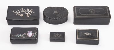 A collection of six mache snuff boxes of rectangular form with inlaid mother of pearl and pewter