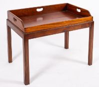 A mahogany butler's tray on stand, 19th Century and later; of rectangular form,