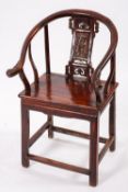 A Chinese stained wood elbow chair,