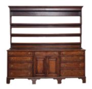 A Regency oak and walnut banded dresser,