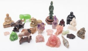 A mixed collection of predominantly Chinese hardstone and other figures and carvings mostly 20th