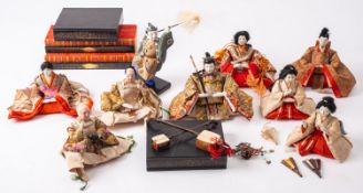 A group of seventeen Japanese Kabuki dolls, primarily depicting musicians,