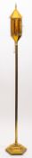 A brass and glazed standard lamp,