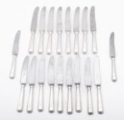 A set of eight silver plate and steel ta