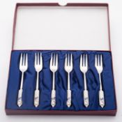 A cased set North Korean Stainless Steel