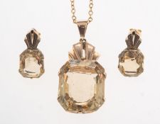 A citrine pendant with chain and a pair