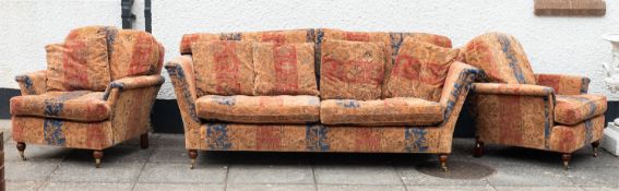 A mid 20th Century three piece suite, co