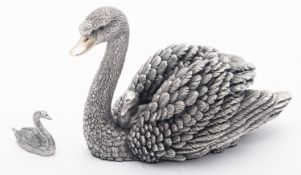 A late 20th century silver covered resin figure of a swan and cygnet, by Country Artist,