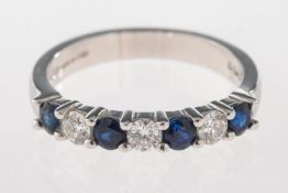 An 18ct gold sapphire and diamond half e