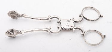 A pair of George III sugar tongs or tea