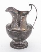 A George V silver cream jug by Sanders &