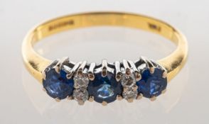 An 18ct gold sapphire and diamond ring,