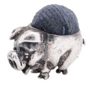 A modern novelty silver pin cushion, in the form of an out of proportion pig,