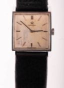 Omega, a gentleman's wristwatch the square silvered dial having raised baton numerals,