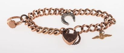A curb link charm bracelet with charms, heart padlock and safety chain, heart padlock marked 9,
