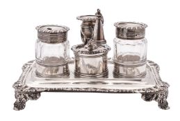 A George IV silver inkstand, of shaped rectangular outline, with a gadroon,