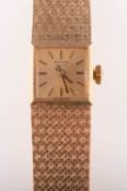Marvin a 9K gold wristwatch the square dial having raised baton numerals,