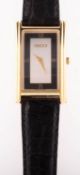 Gucci a gold-plated lady's wristwatch the rectangular two-tone dial with Roman numerals at III, VI,