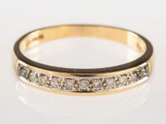 A 9ct gold diamond half eternity ring, grain set with eleven brilliant-cut diamonds,