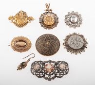 A mixed group of antique costume jewellery, including six brooches of varying design,