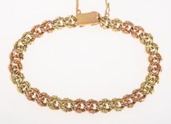 A two colour fancy link bracelet, push in clasp and safety chain,