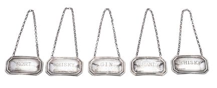 Five modern silver wine labels, of canted rectangular form, two incised 
