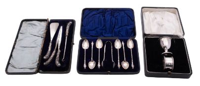 Three various cased sets of silver, including a three-piece dressing set (shoehorn,