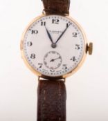 J W Benson, a 1930s 9K gold wrist watch the white dial having black Arabic numerals,