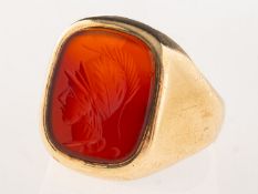 A 9ct gold carnelian intaglio ring, the carnelian being carved with a Roman Centurion bust,