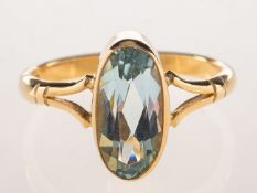 A 9ct gold aquamarine ring, collet set with an elongated oval-cut aquamarine, measuring approx. 11.