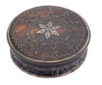 A late 18th/ early 19th century tortoiseshell & piqué-work snuff box, circular form,